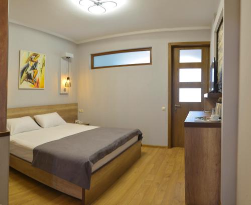 Ein Bett oder Betten in einem Zimmer der Unterkunft Hotel Livin