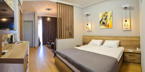 Ein Bett oder Betten in einem Zimmer der Unterkunft Hotel Livin