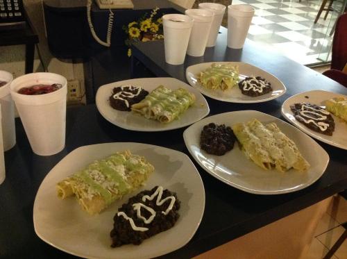 a table with four plates of desserts on them at Best Western Hotel Plaza Matamoros in Matamoros
