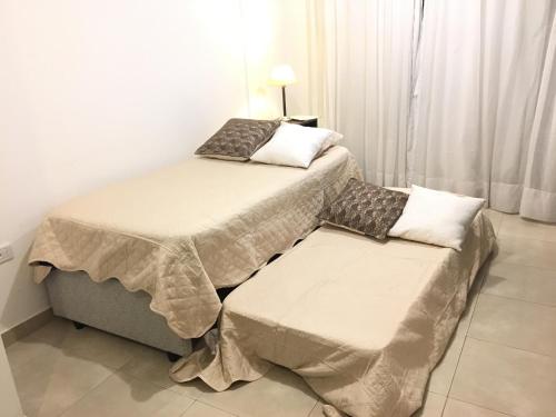 Una cama o camas en una habitación de Apartamento Mig