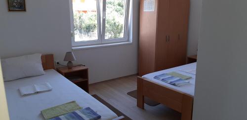 Postel nebo postele na pokoji v ubytování Vila Velebit