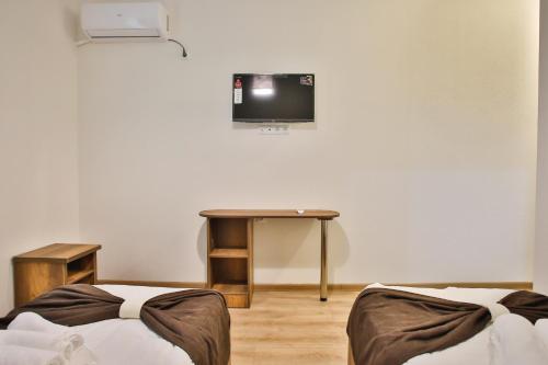 TV a/nebo společenská místnost v ubytování Chveni Qalaqi