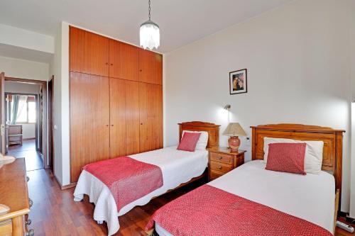 Una cama o camas en una habitación de Faro Classic Apartment by Homing