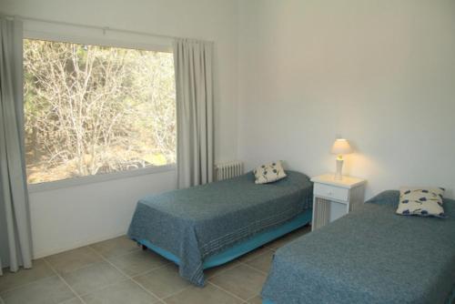 เตียงในห้องที่ Complejo Tridente