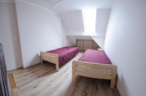 Posteľ alebo postele v izbe v ubytovaní Apartamenty Giżycko