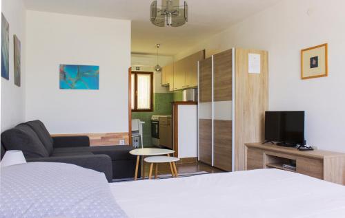 a hotel room with a bed and a living room at Twin Oaks in Šišan