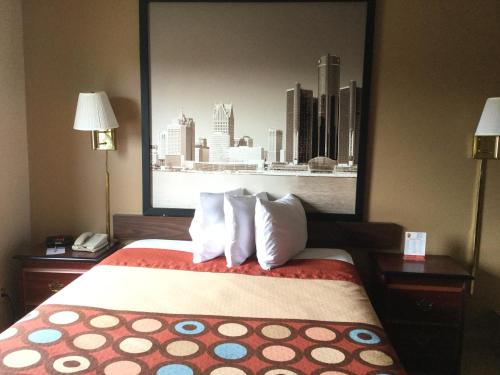 a hotel room with a bed with a view of a city at Super 8 by Wyndham Imlay City in Imlay City