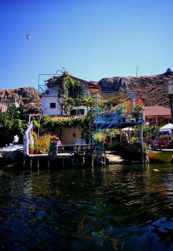 a house on a dock on the water at Rosa B&B in Lin