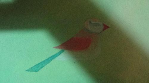 a paper bird with a hat on a table at Hacienda Tropical Guest House in Belmopan
