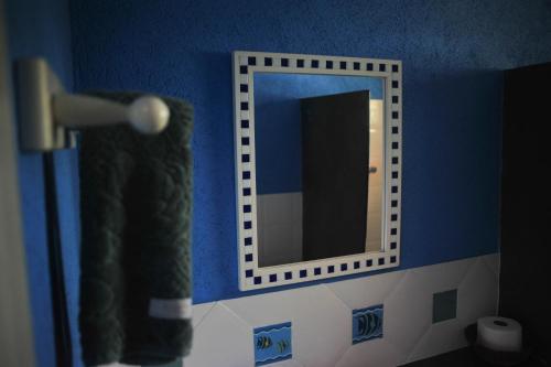 a mirror in a bathroom with a blow dryer at Pousada Manacás in Cavalcante
