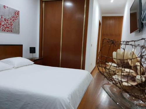 A bed or beds in a room at Bloco 3 Agueda