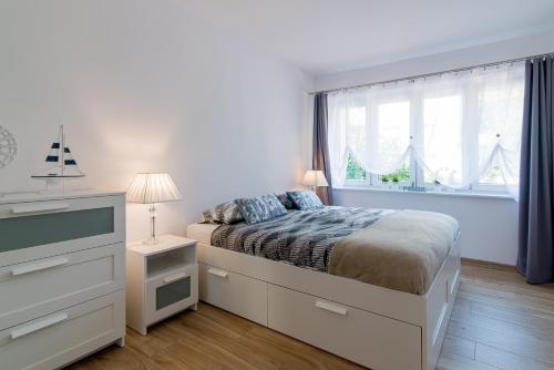 Posteľ alebo postele v izbe v ubytovaní Praia Apartments - 200m do Plaży Orłowo - Parking - Apartament Laguna