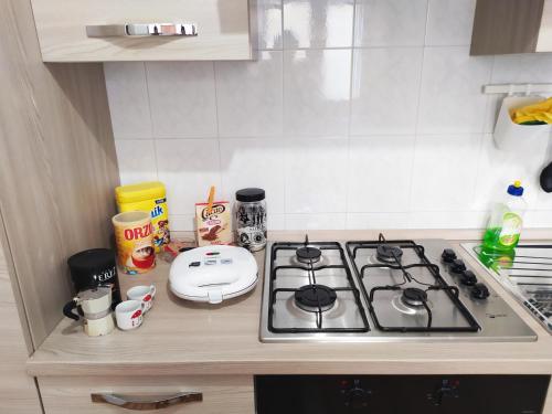a kitchen counter with a stove top in a kitchen at Siracusa Ortigia by Duomo in Siracusa