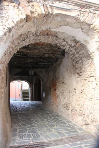 an alley way in a stone building with a tunnel at Le Vie Mediterranee in Torre di Ruggiero