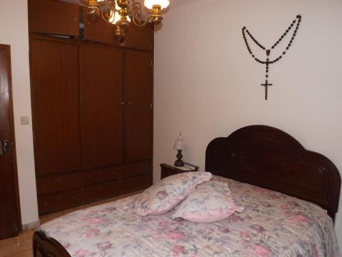 a bedroom with a bed with two pillows on it at A casa da vila in Sousel