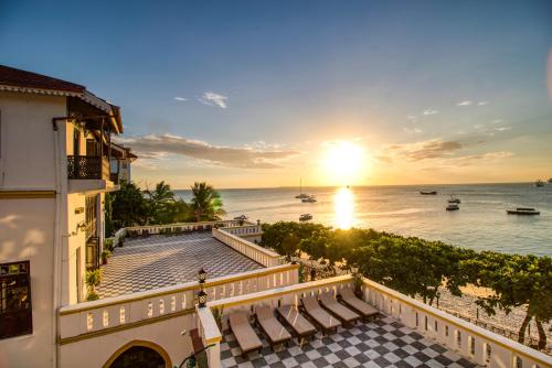 a view of the ocean from the balcony of a hotel at Tembo House Hotel in Zanzibar City