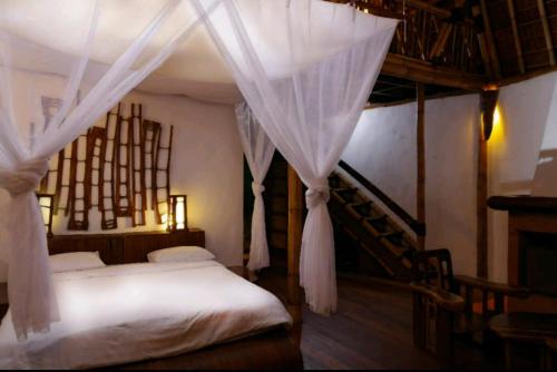 Кровать или кровати в номере Bali Eco Village