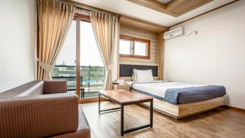 Postel nebo postele na pokoji v ubytování Dawoo Resortel