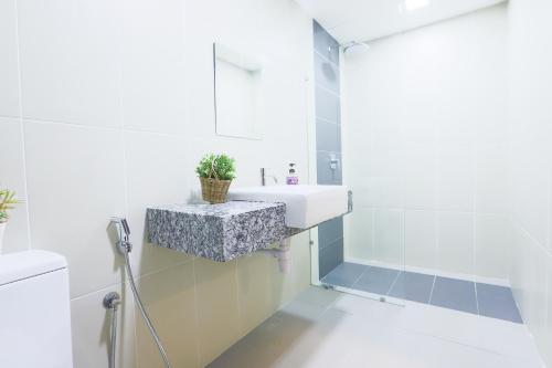 a bathroom with a sink and a shower at Platinum Homestay @ Selayang Residence 280 in Batu Caves