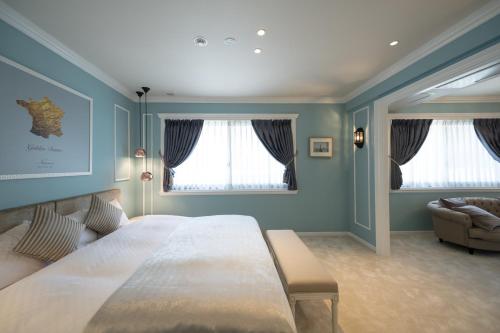 Ένα ή περισσότερα κρεβάτια σε δωμάτιο στο HOTEL SHIKISAI KYOTO