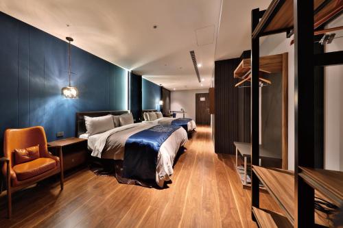 A bed or beds in a room at Saint Art Hotel