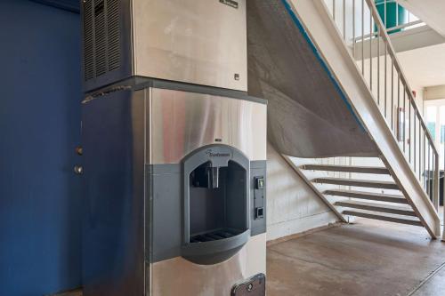 a large elevator in a building with a staircase at Motel 6-Atlanta, TX in Atlanta
