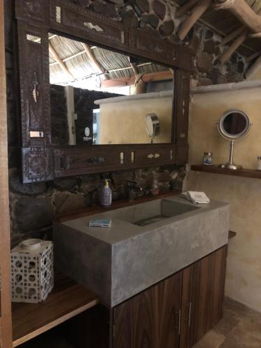 a bathroom with a sink and a mirror at Casa Miura Hotel Boutique in Ajijic