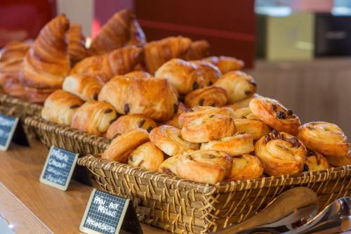 two baskets of pastries on display in a bakery at Best Western Plus Antibes Riviera in Antibes