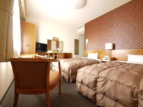Letto o letti in una camera di Hotel Route-Inn Kitami Odorinishi