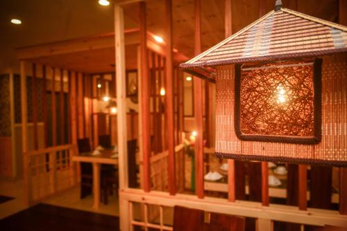 a light hanging from the ceiling of a room at Galaxy Grand Hotel in Nuwara Eliya