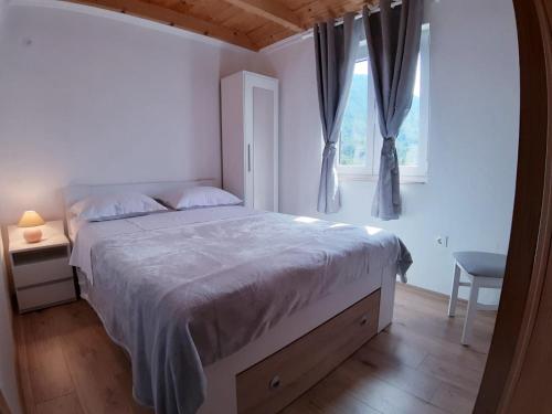 Säng eller sängar i ett rum på Kuća za odmor Dobrila