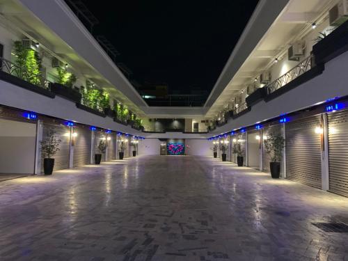 an empty hallway of a building at night at Roppongi Motel - JianHua in Pingtung City