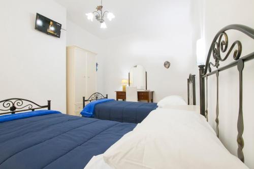 Postel nebo postele na pokoji v ubytování Le Maschere B&B