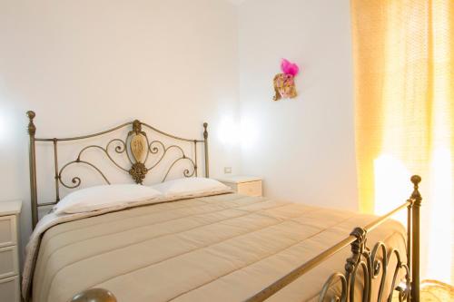 Postel nebo postele na pokoji v ubytování Le Maschere B&B