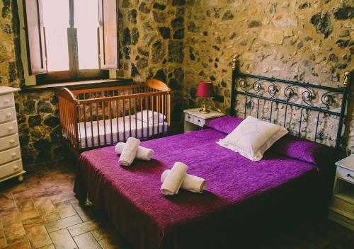 a bedroom with two beds with towels on them at Masia Can Solà Gros in Caldes de Malavella