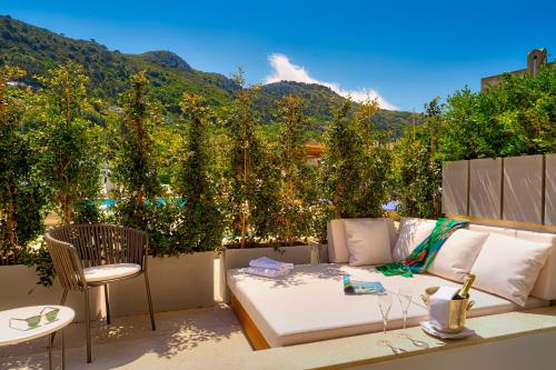 a living room with a couch and a view of a mountain at Hotel Villa Blu Capri in Anacapri