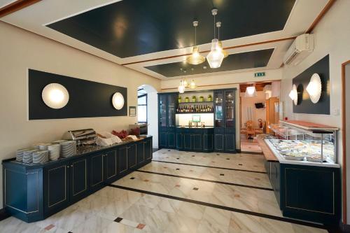 a restaurant with a counter in a room at Hotel Villa Adriana in Monterosso al Mare