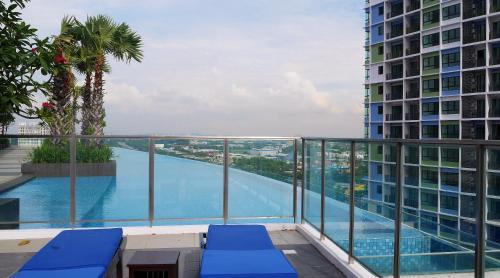 a view of a swimming pool from a building at Studio Apartment with Balcony by Host Assist i-City in Shah Alam