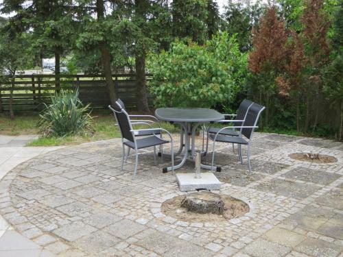 a table and chairs sitting on a patio at Ferienhaus Bavendorf in Thomasburg