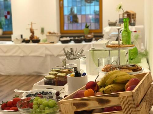 a buffet of fruits and vegetables on a table at Flair Hotel Grüner Baum in Donaueschingen
