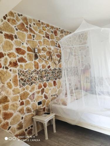 Ένα ή περισσότερα κρεβάτια σε δωμάτιο στο Malvina Rooms