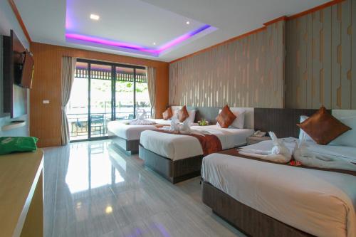 Кровать или кровати в номере Coco Bella Hotel