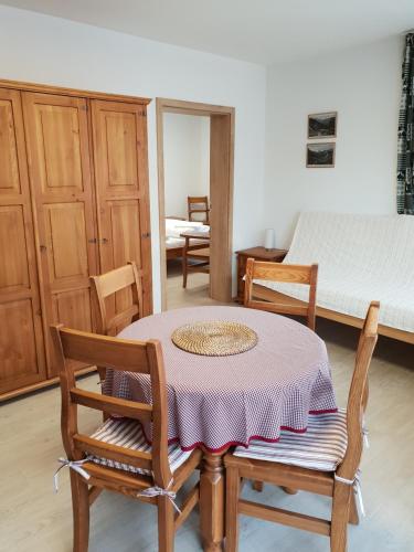 a room with a table and two chairs and a bed at Amalia Haus in Tux