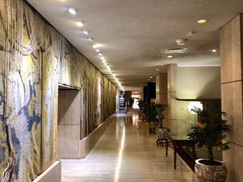 a hallway in a building with a long corridor at The Royal Hotel by Coastlands Hotels & Resorts in Durban