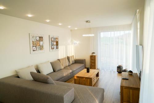 a living room with a couch and a coffee table at Luxury Villa in Moravany nad Váhom