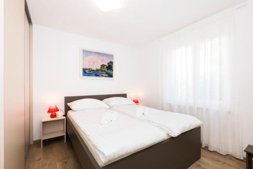 A bed or beds in a room at Villa Artaturi