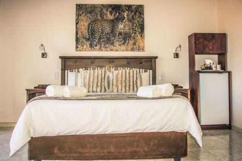 a bed with two towels on top of it at Mawusi Bush Lodge in Hoedspruit