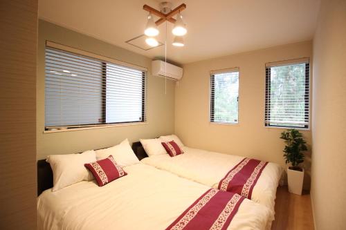 Giường trong phòng chung tại HOPE VILLA ONNASON