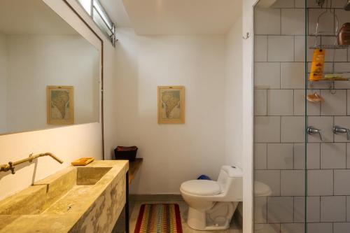 a bathroom with a sink and a toilet at Colonial Villa in Laureles in Medellín