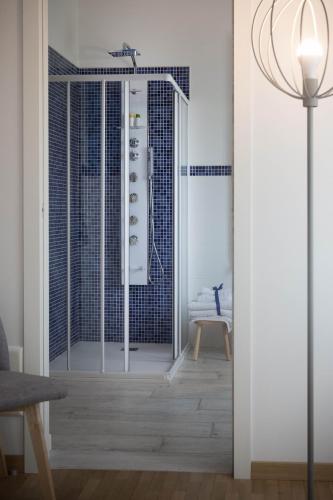 a bathroom with a shower with a glass door at La Casa di Amedeo in Piombino Dese